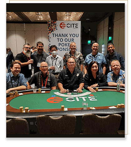 Convention attendees that made the final table at a poker tournament pose for a picture.