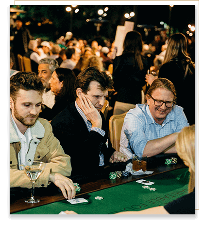 Three poker players anxiously awaiting the results of a poker hand.