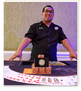 Dealer standing behind Wildcard Table.