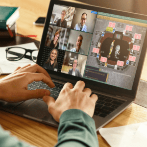 image of a laptop where someone is playing poker and seeing their opponents on Zoom