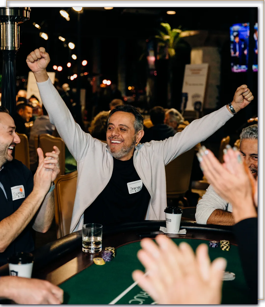 TPP Charity Hero Image Man celebrates winning a hand at a charity poker tournament.