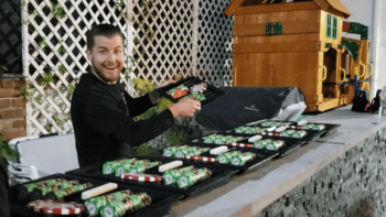 Poker dealer sets up chips on the counter.